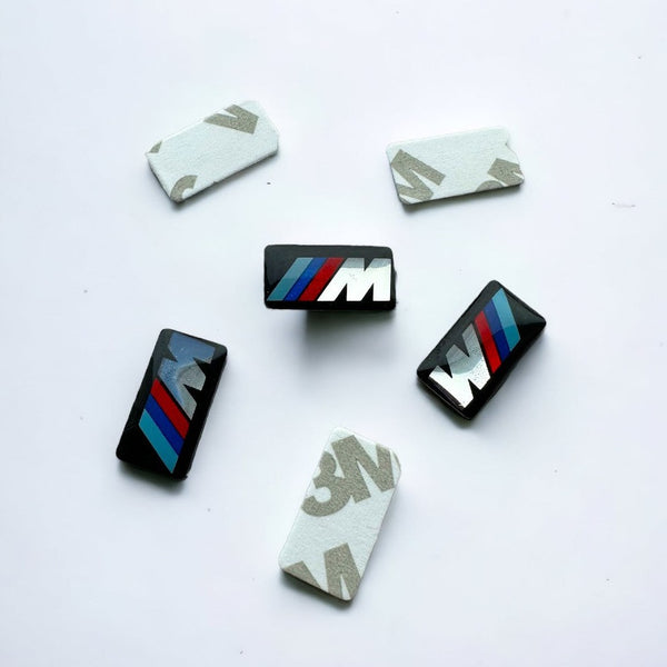 BMW M Lipdukai tinkantis ratlankiams, vairui, pavarų svirčiai bei kitoms automobilio vietoms